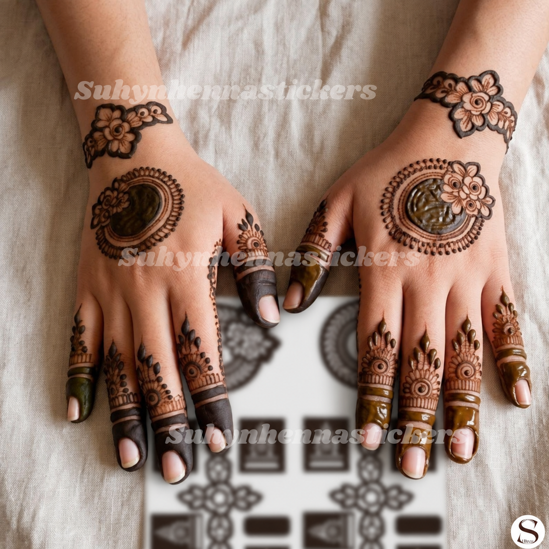 ALT TEXT
Floral mirror minimal Mehendi stencil with circular hand motifs floral wrist bands and delicate finger patterns by Suhyn
