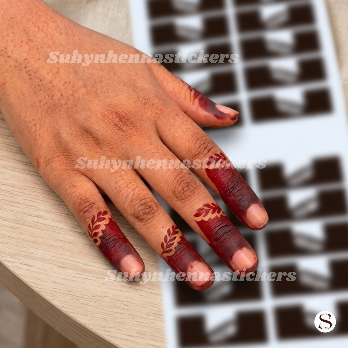 Leaf cuff finger Mehendi stencil with solid fingertip sections and small botanical accents by Suhyn