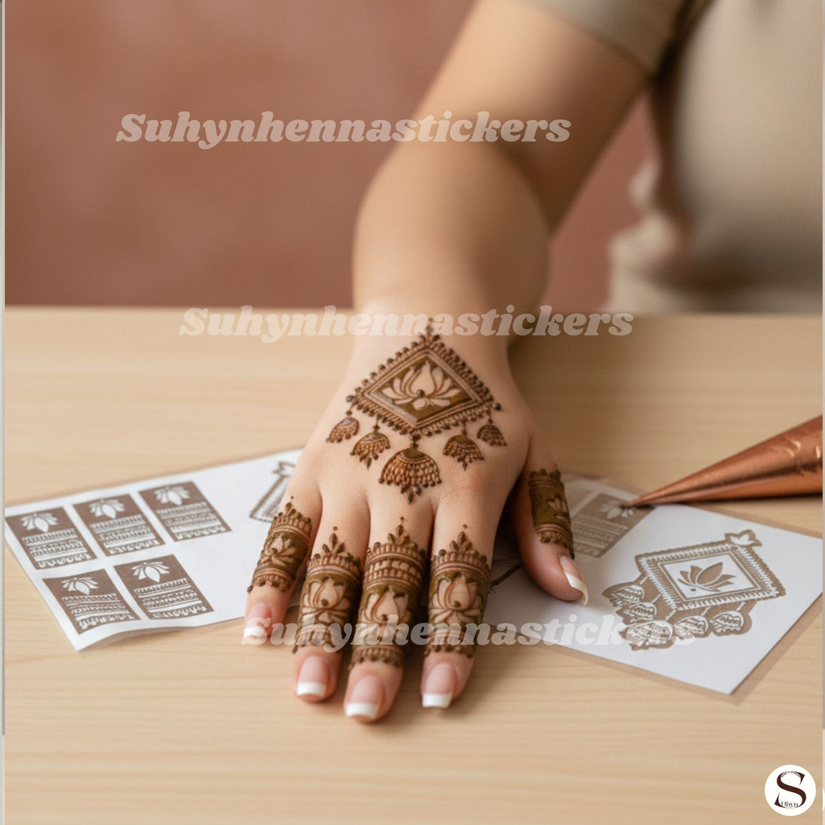 Lotus frame Mehendi Sticker with diamond-shaped floral centre, hanging bell accents and coordinated finger motifs by Suhyn
