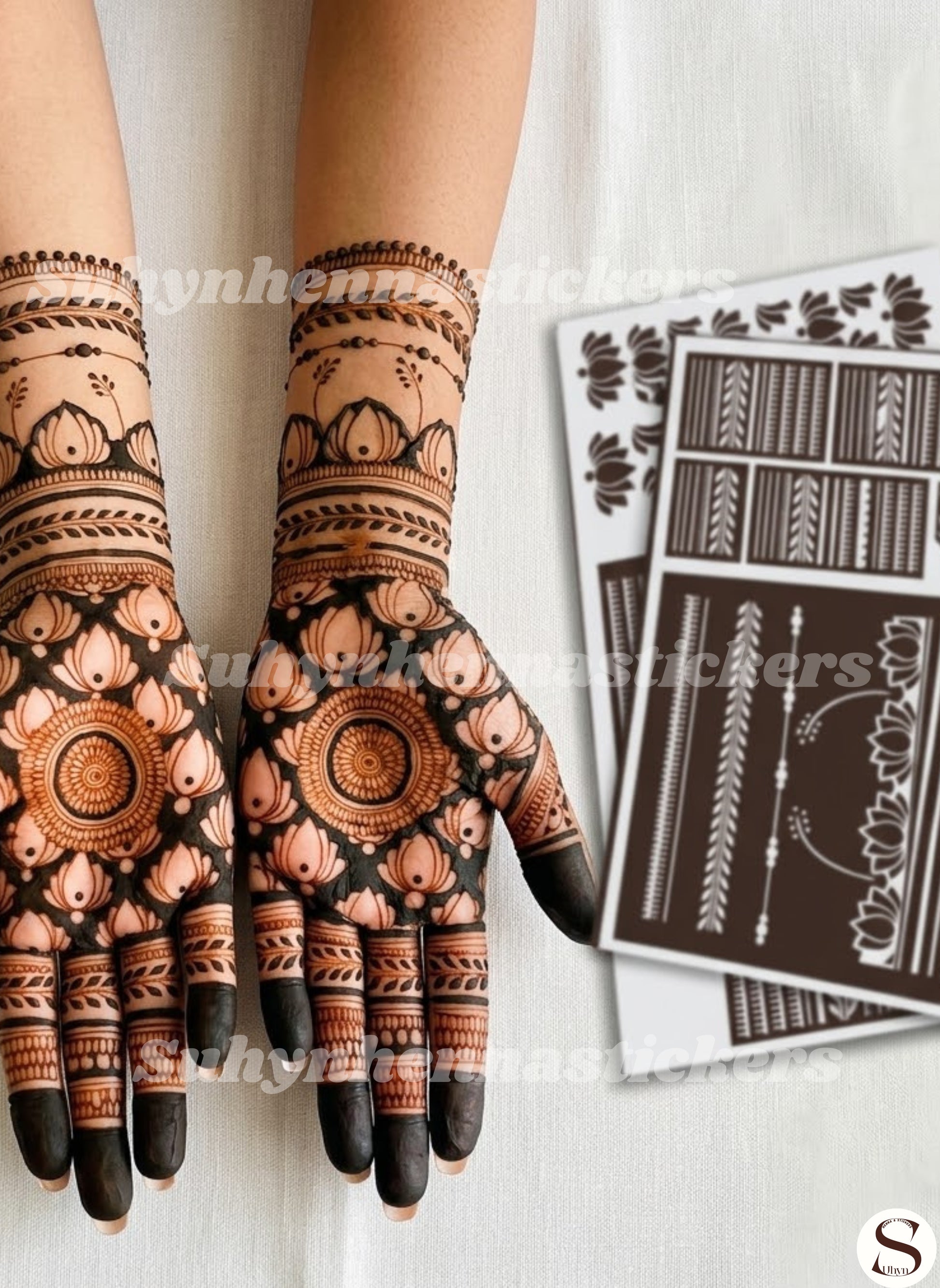 Lotus-filled palm mehendi design with circular mandala centres, petal framing, and layered wrist borders from Suhyn

