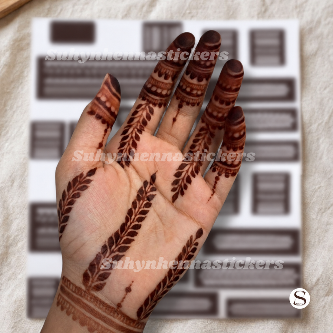 Olive branch palm Mehendi stencil with long leafy trails decorative finger bands and minimal wrist detailing by Suhyn